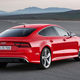 A red Audi RS7 parked on a runway.